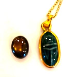 Yellow Saphire and small carved green pendant.